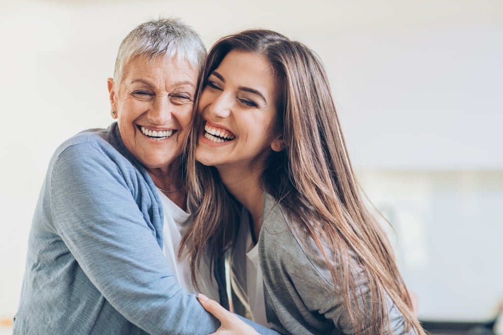 happy adult mother and daughter embracing picture id658448764