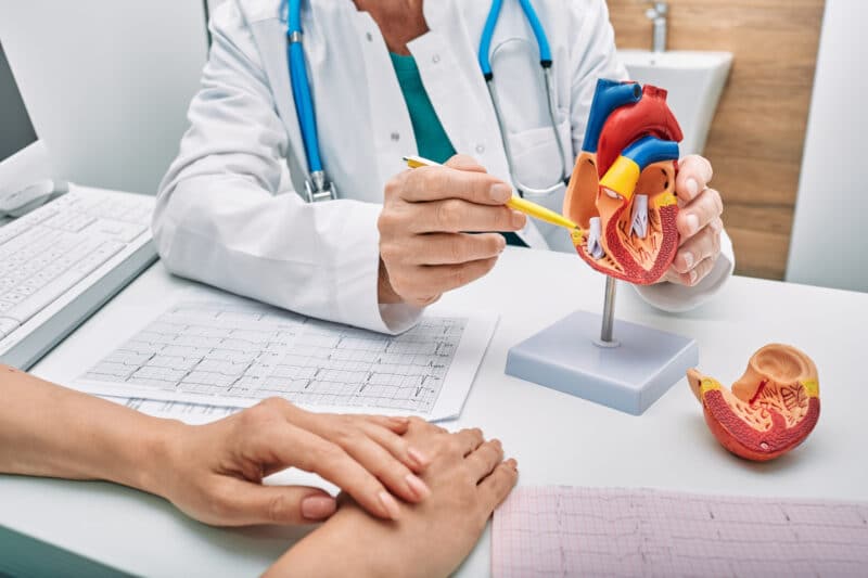 A doctor educating a patient on how a pacemaker works