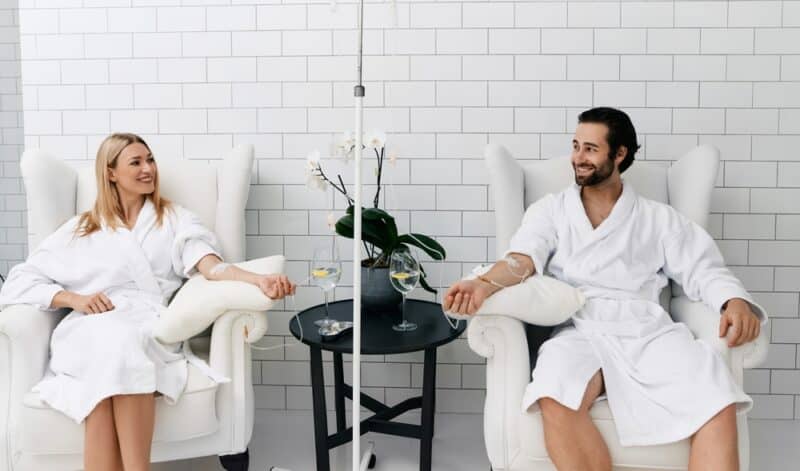 A young healthy and happy couple getting IV therapy