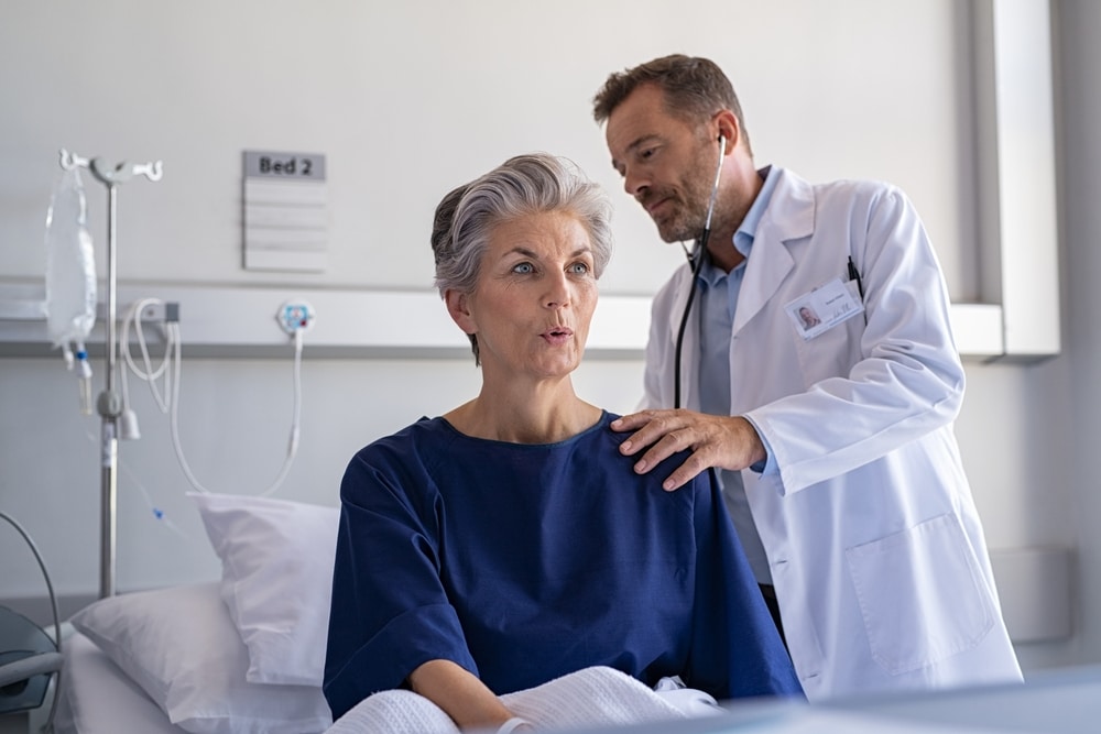 Older woman being examined by doctor in order to manager her respiratory health condition.