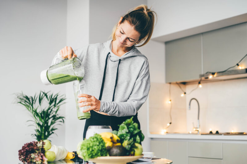 Woman making herself a smoothy for cholesterol management in Show Low, AZ