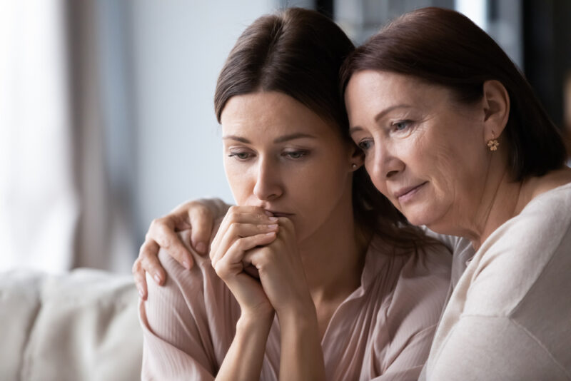 Mom consoling adult daughter after lung cancer diagnosis in Show Low, AZ