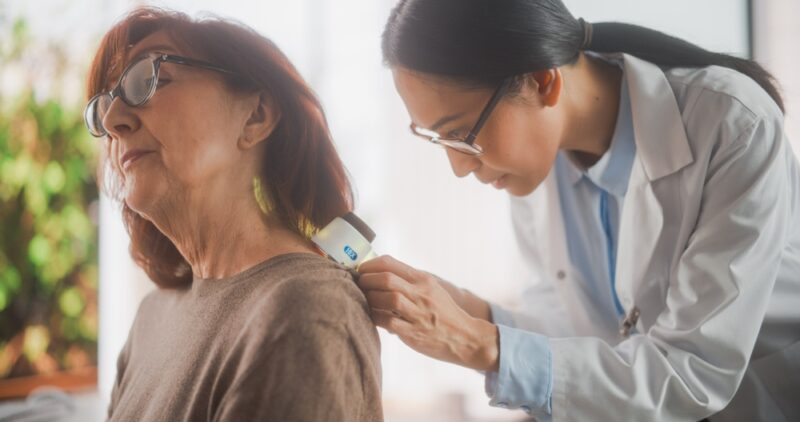 Woman having skin checked for skin cancer in Show Low, AZ